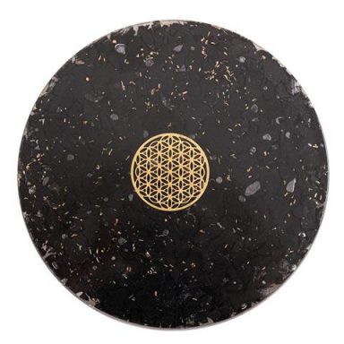 Schwarze, runde Platte mit goldener blühender Lebensblume in der Mitte.