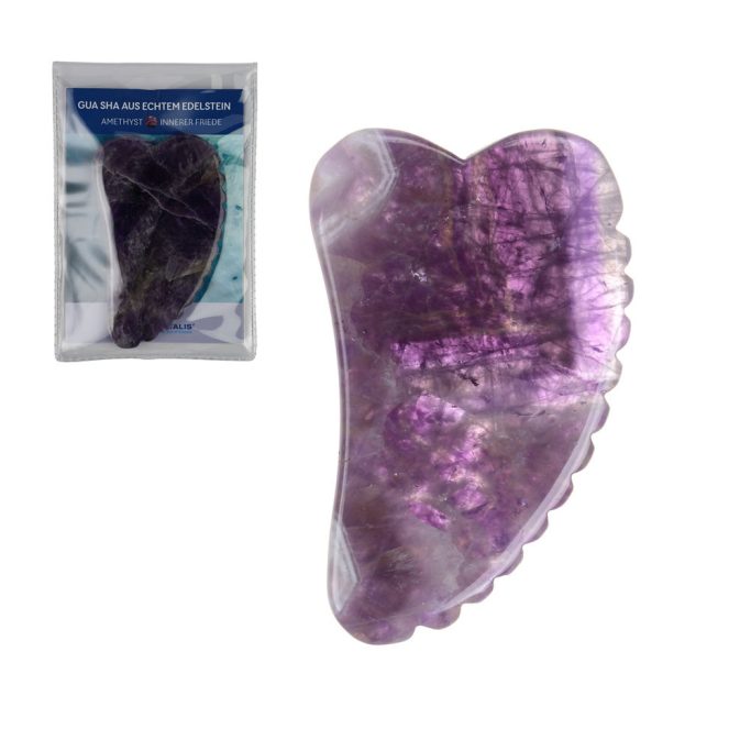 Lila Massagegerät aus Kristall mit gewellten Kanten, präsentiert in Verpackung.